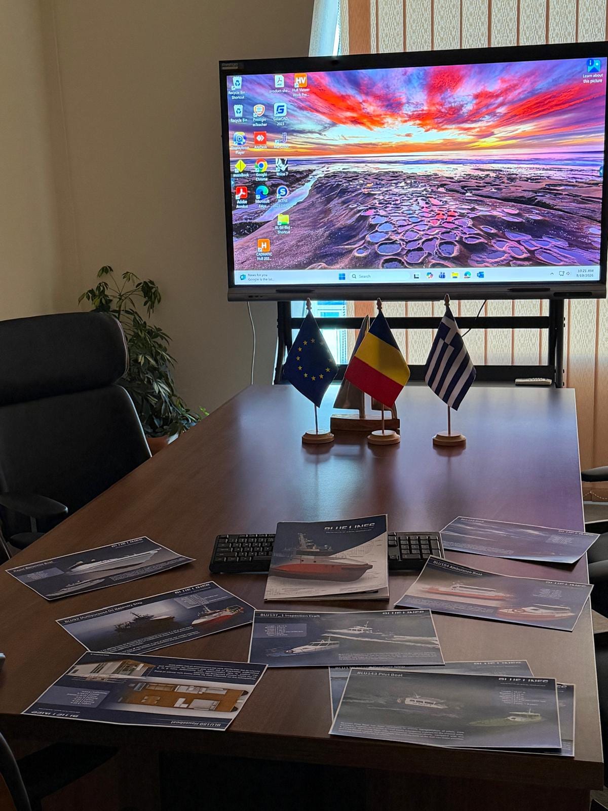 Blue Lines meeting room with EU, Romanian and Greek flags and vessel design boards