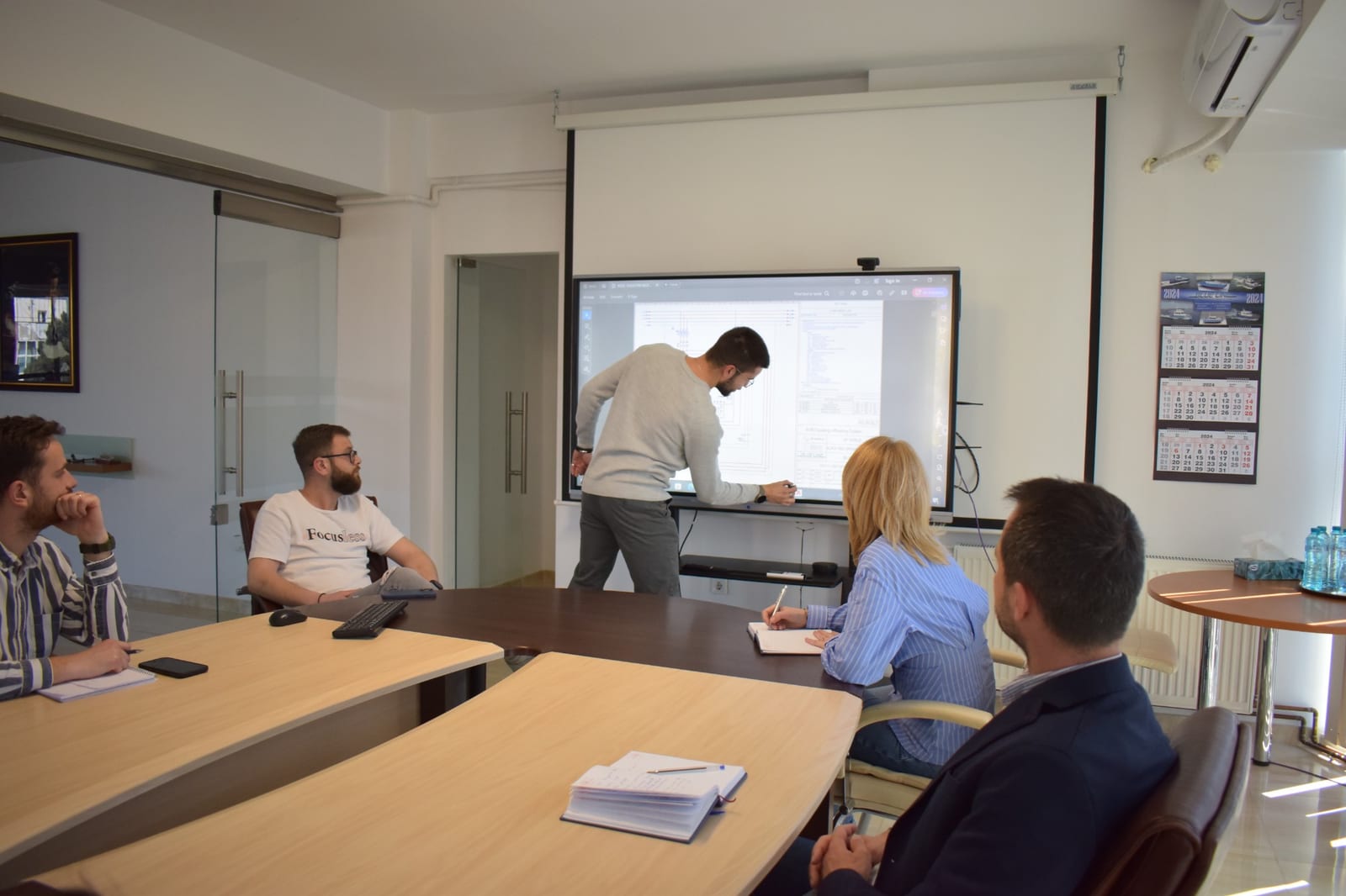The Blue Lines team reviewing a vessel design during an internal meeting